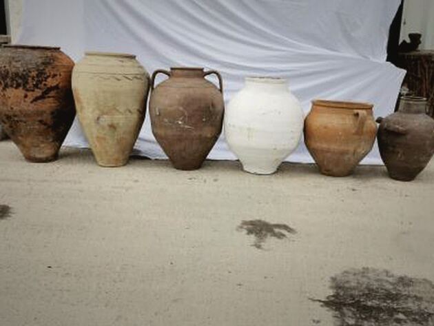 Mid-Size Anatolian Pot — row of six round-bellied pots in brown, cream, white and terracotta