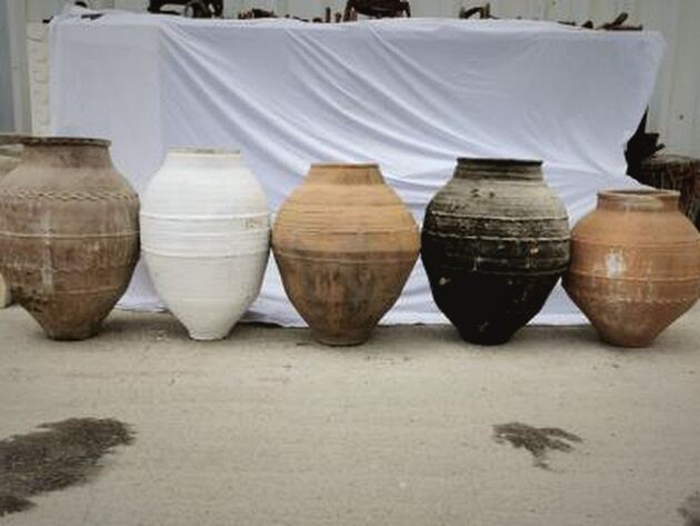 Belted Amphora — five pointed-base amphorae in white, buff, black and rust with ridged bands