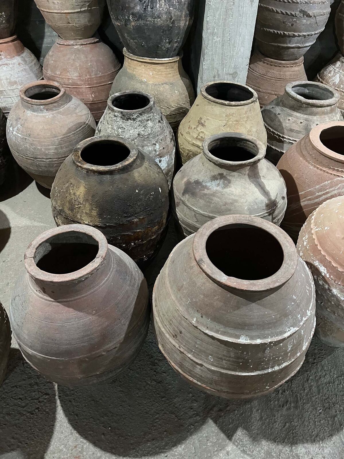 Double-Belted Amphora — large grey and terracotta double-belted jars grouped together