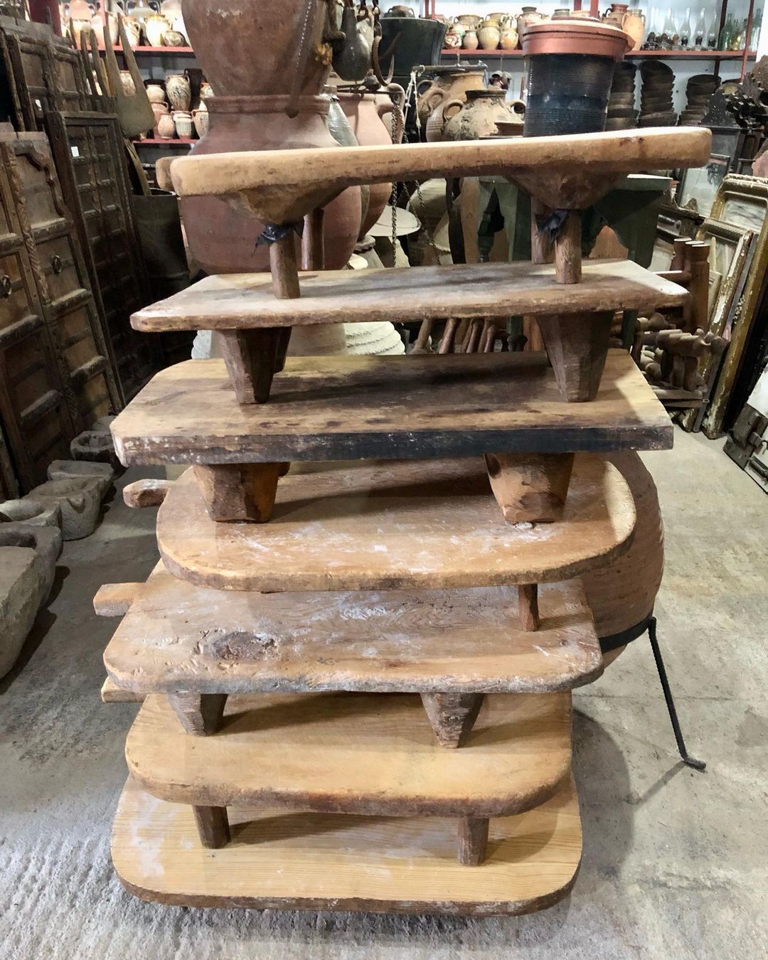 Senit Wood Board — tower of low wooden tables stacked one above the other