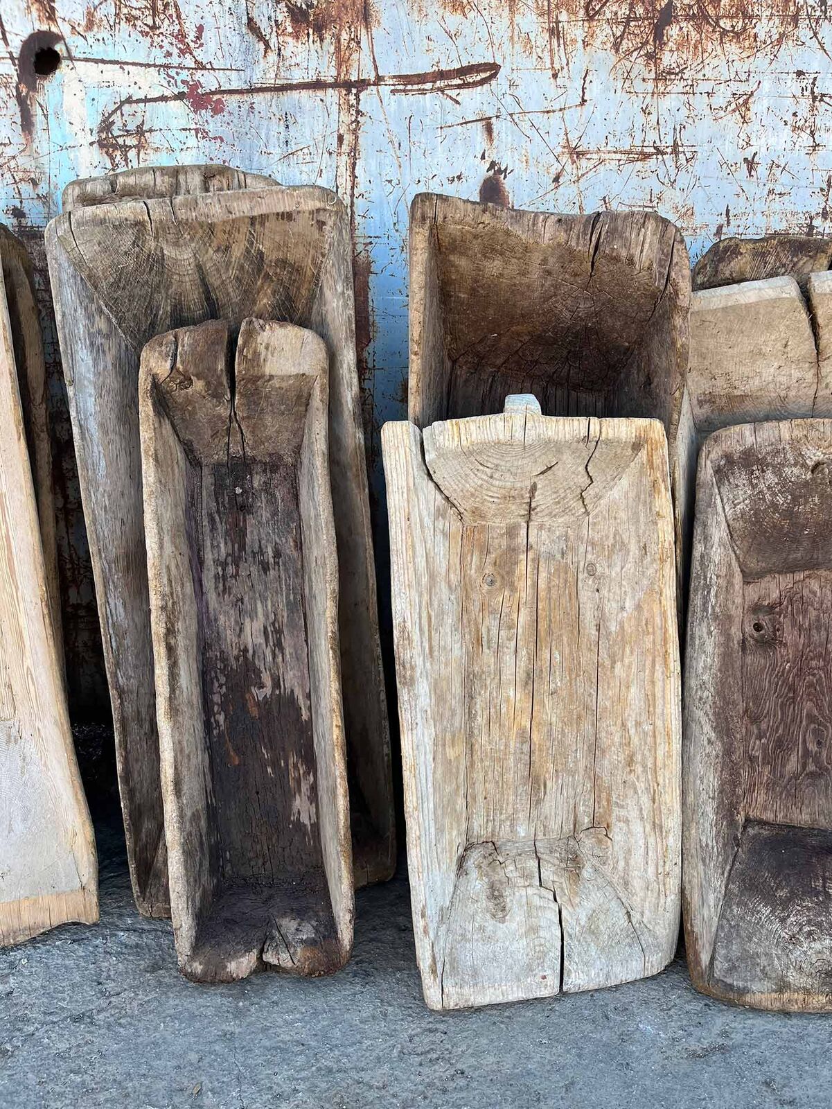 Wooden Trough, Square — tall narrow hollowed wooden troughs leaning together