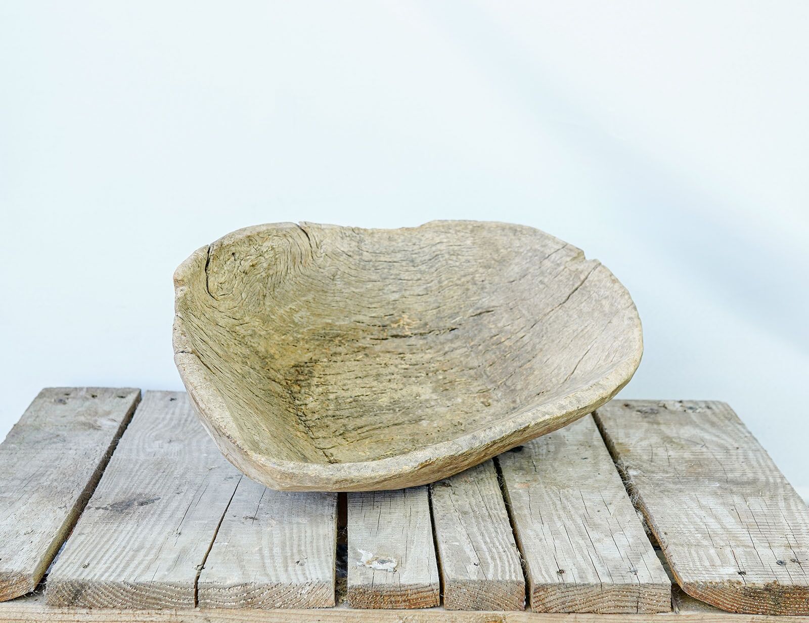 Wooden Trough, Round — shallow oval wooden bowl on a wooden pallet