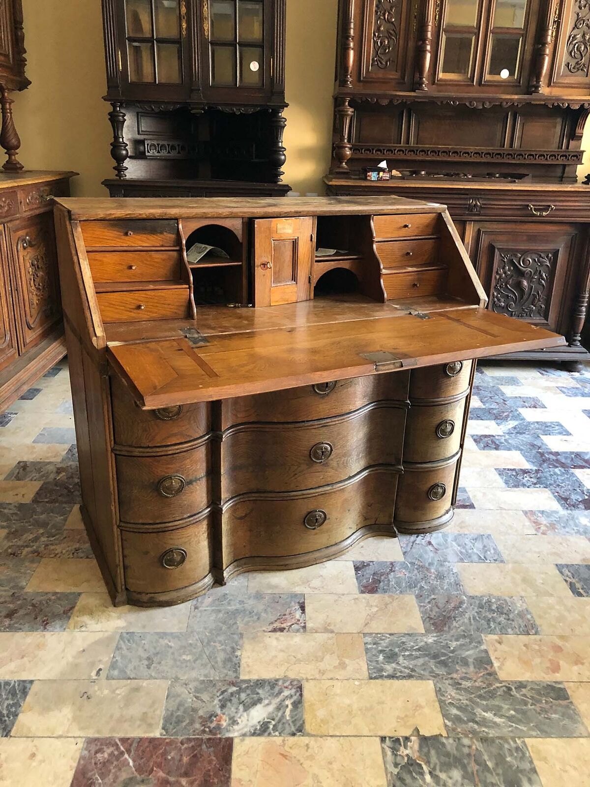 Wooden Writing Desk — wooden bureau with a fall front, small drawers and a serpentine base
