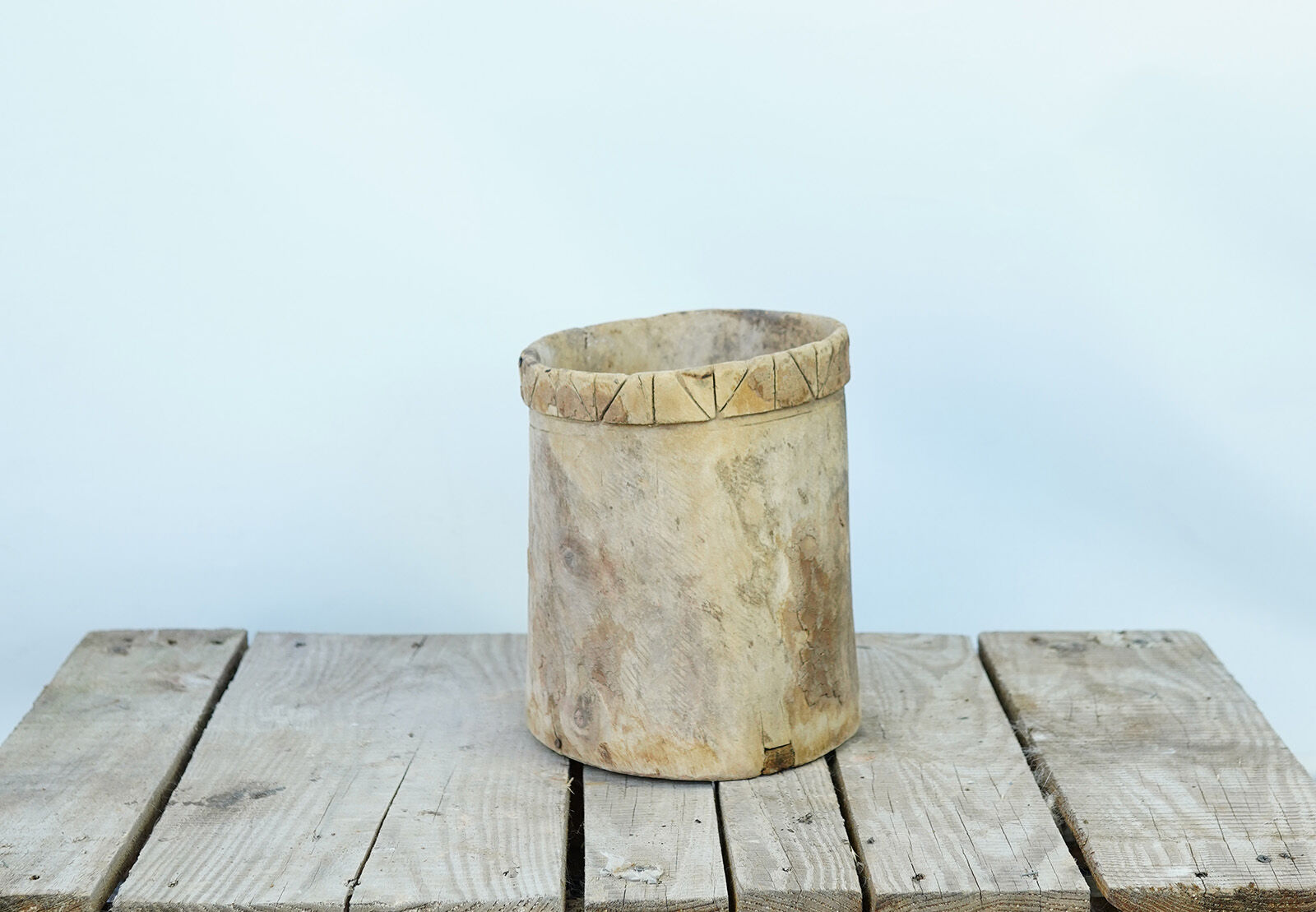Wooden Grain Measure — round wooden grain measure with a carved rim