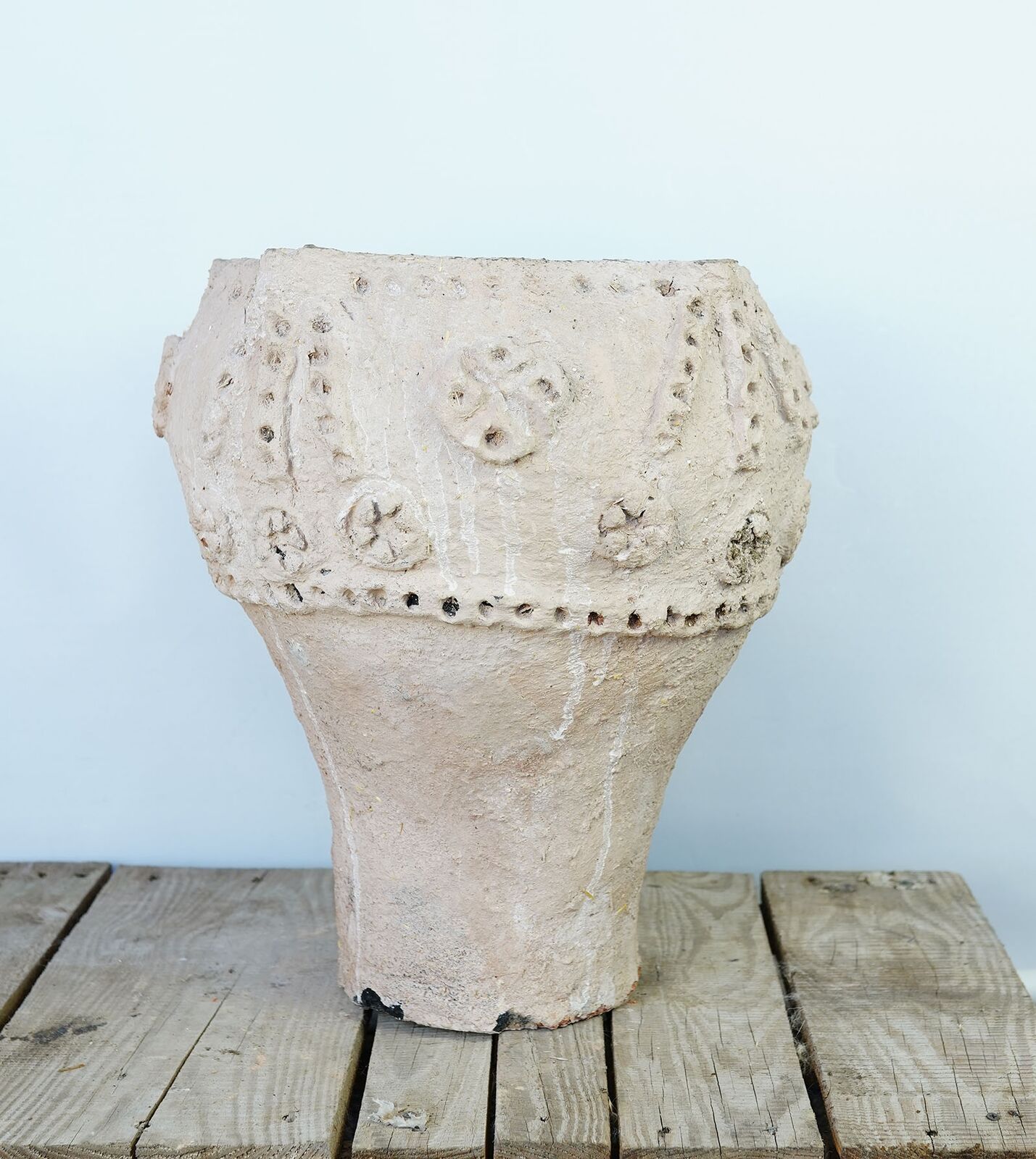 Urfa Water Jar — pale clay water jar with raised round decoration on a wooden pallet