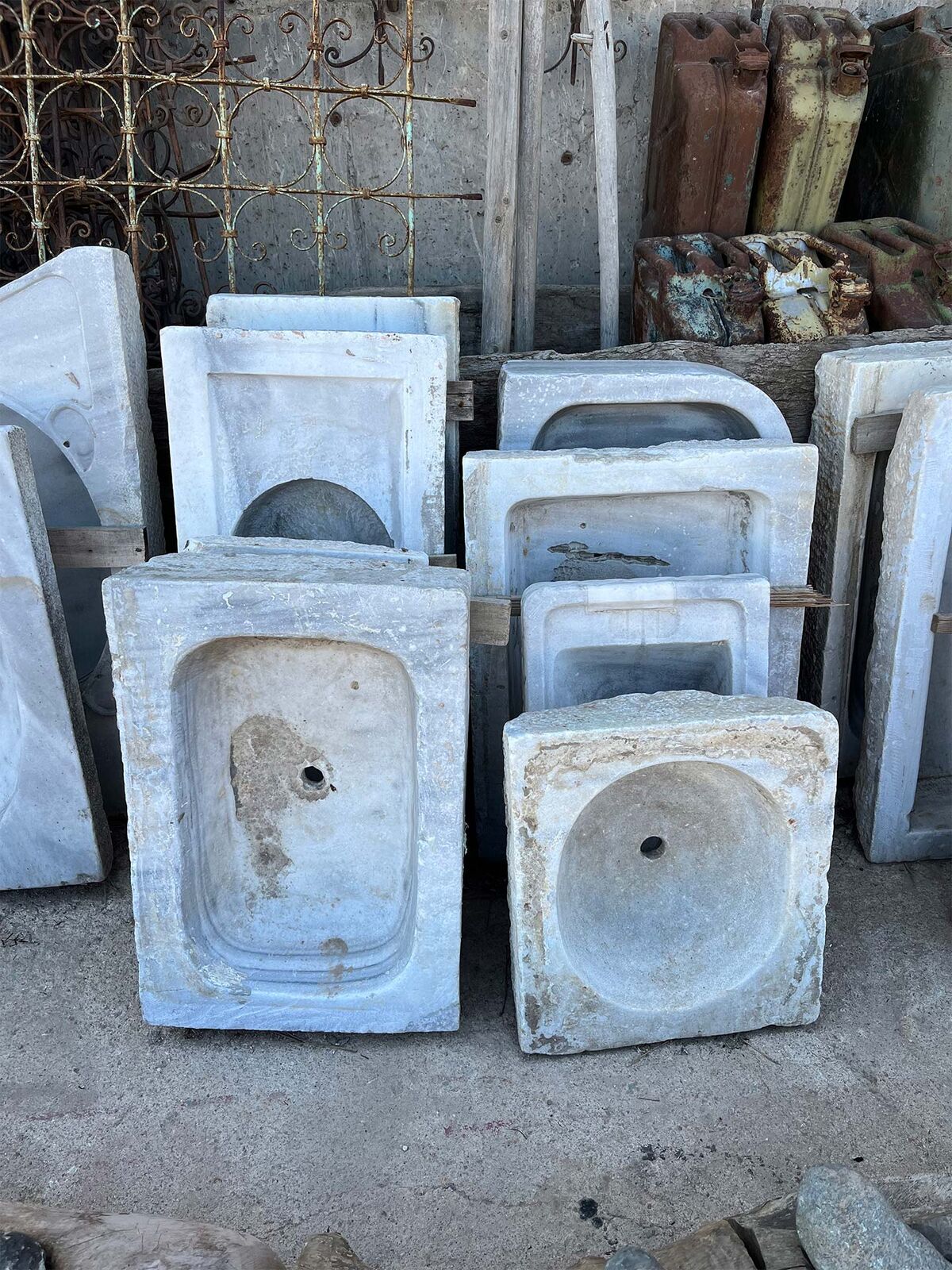 Marble Sink Basin — stack of white wall-mounted marble sinks