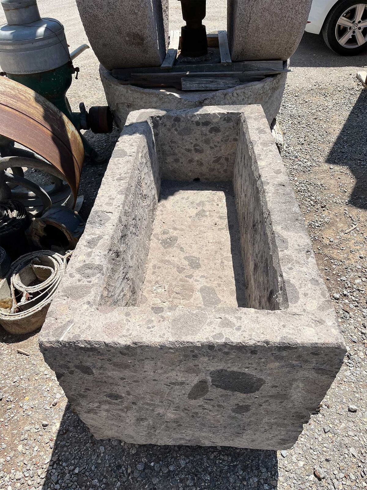 Limestone Trough — weathered stone trough standing in a yard