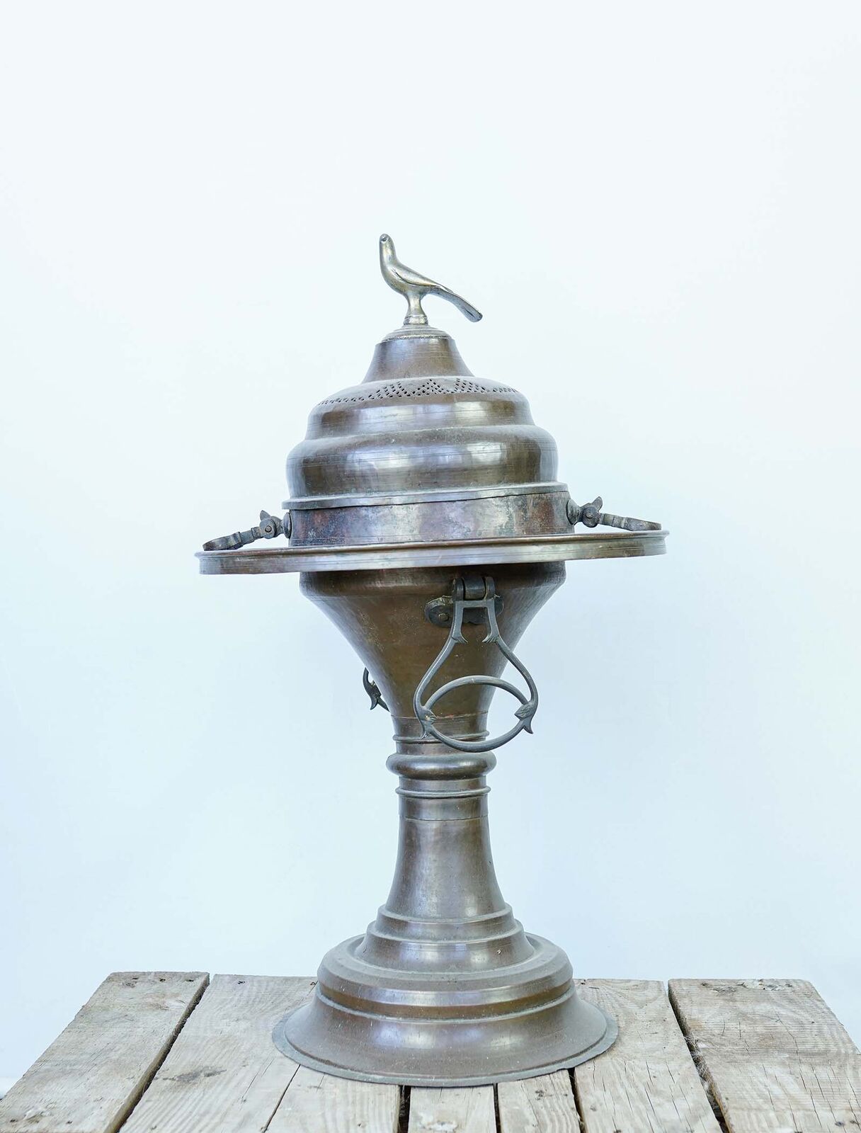 Lidded Metal Brazier — tall metal brazier with a domed lid, bird finial, side handles and a pedestal foot