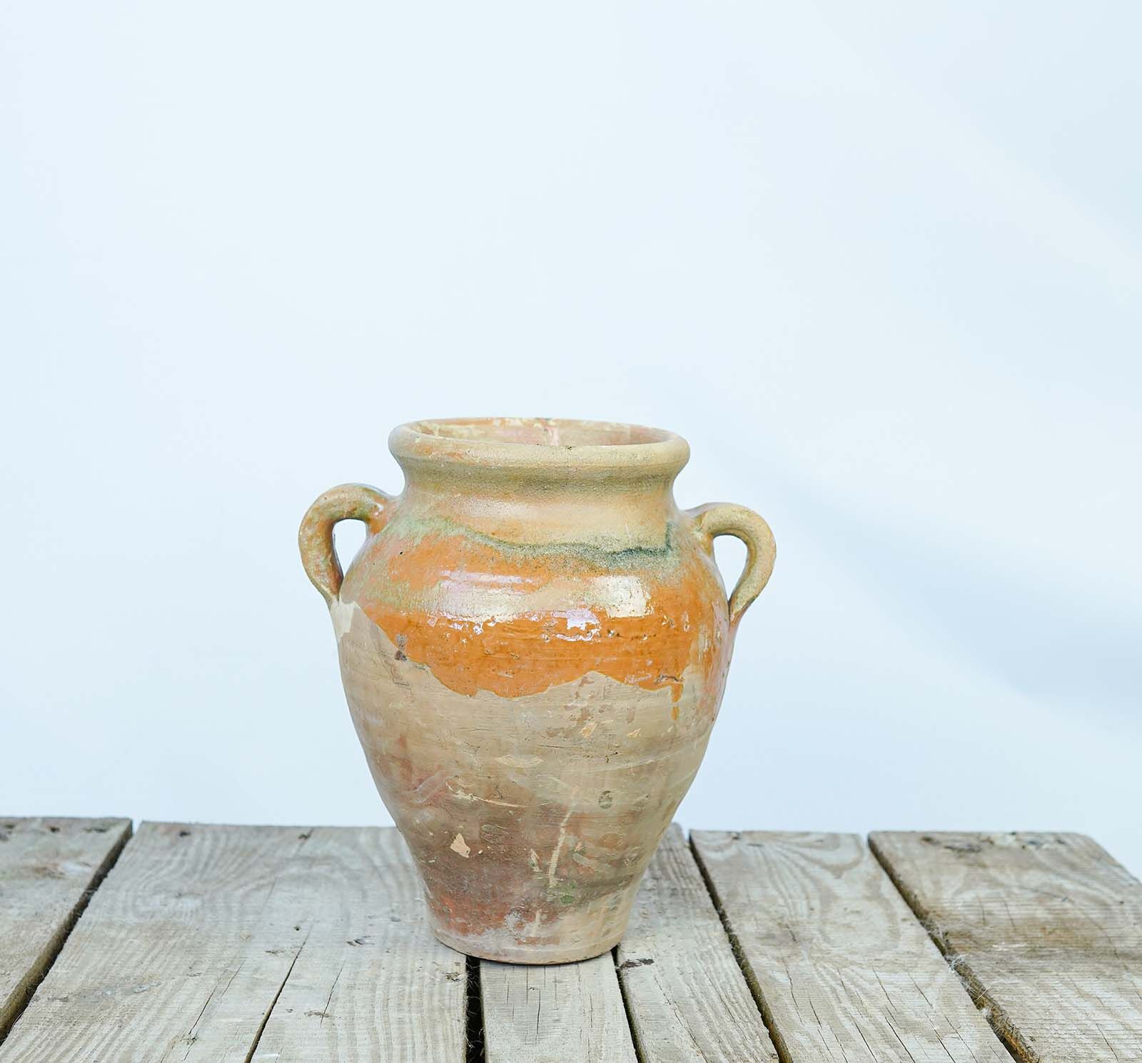 Konya Glazed Jar, Amber — cream jar with amber glaze and two handles on a pallet