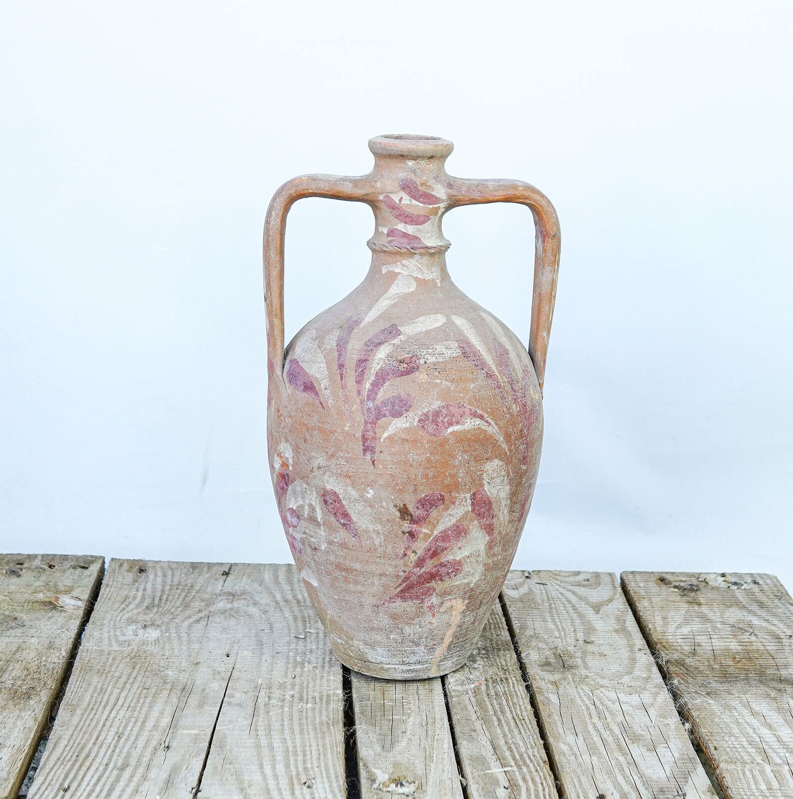 Amphora Jug — amphora jug with pale painted marks on a wooden pallet