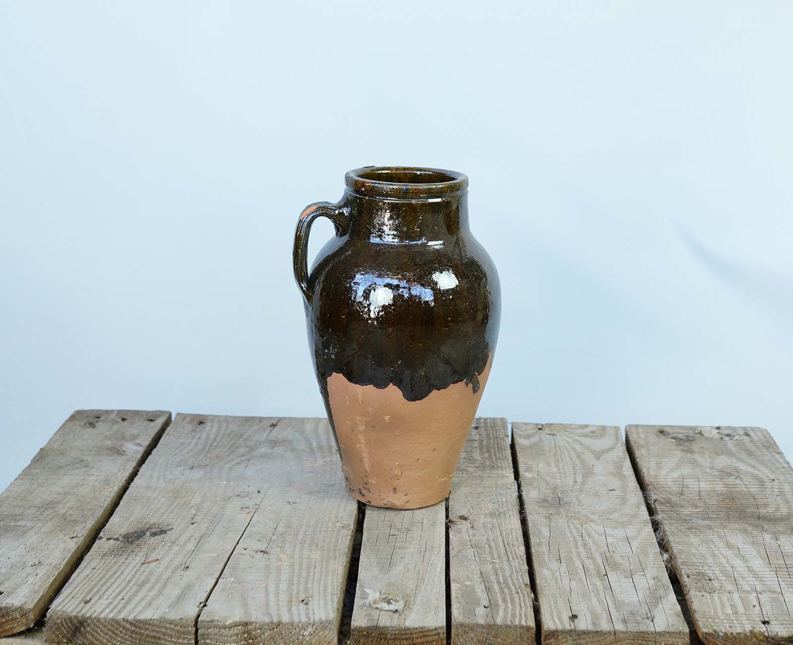 Konya Glazed Jar, Dark Brown — dark brown glazed jar with two handles on a wooden pallet