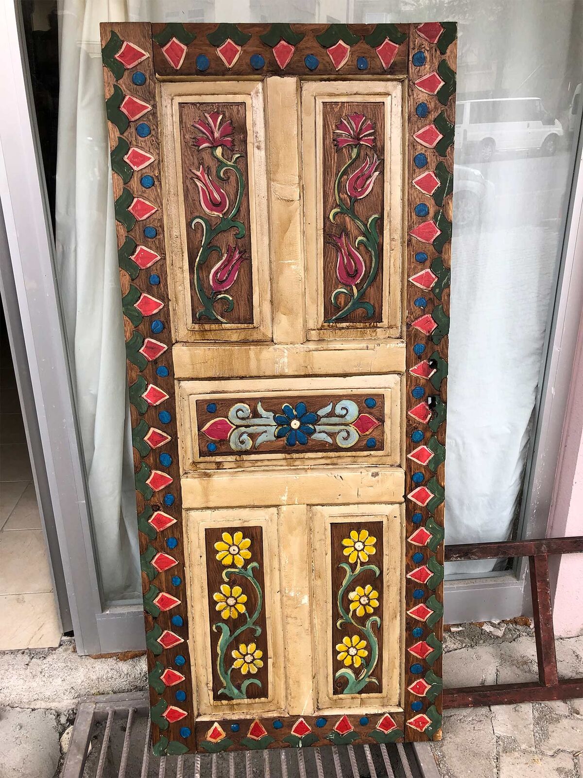 Painted Door, Geometric Border — painted wooden door with floral panels and a red diamond border