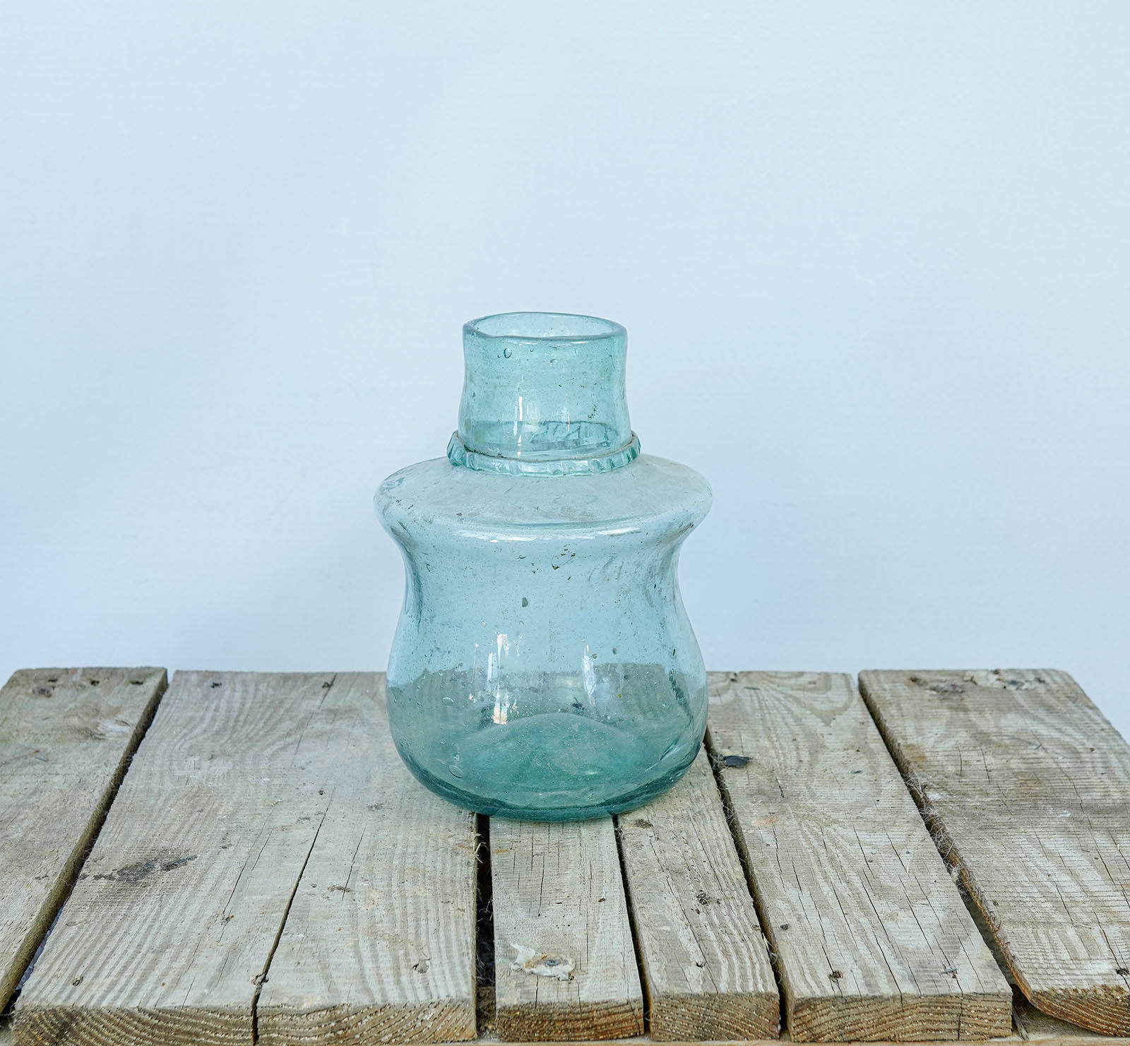 Hand-Blown Glass Jar — clear aqua glass jar with a short neck and rounded shoulder